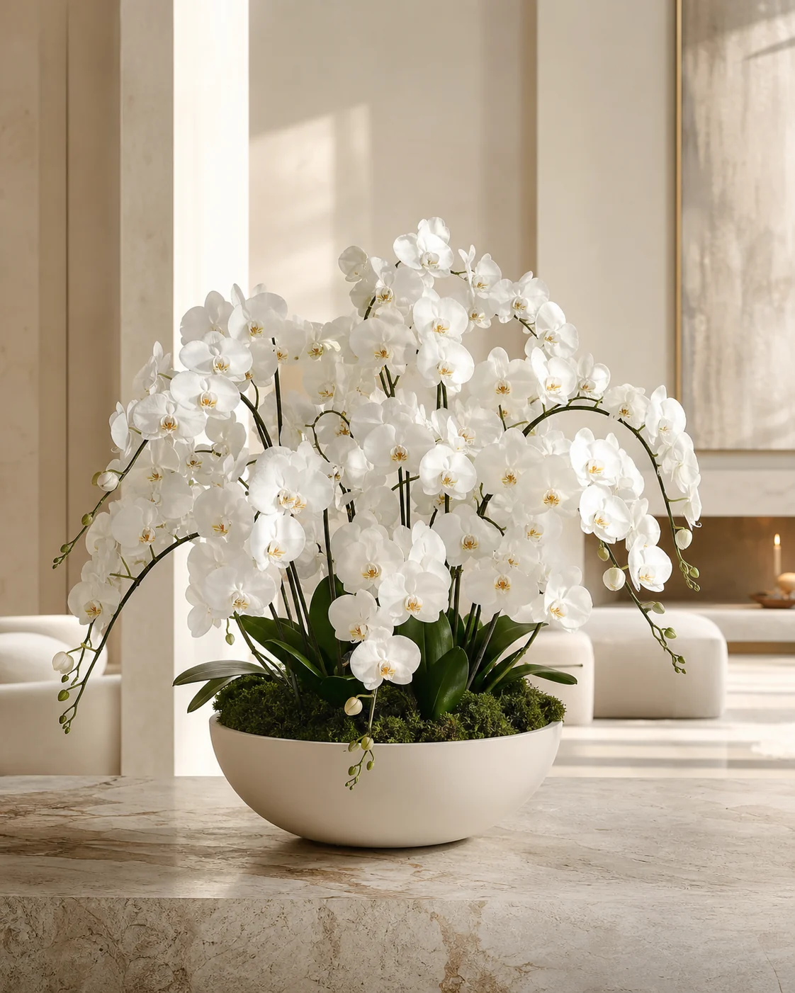 White orchids arranged in a matte ivory bowl